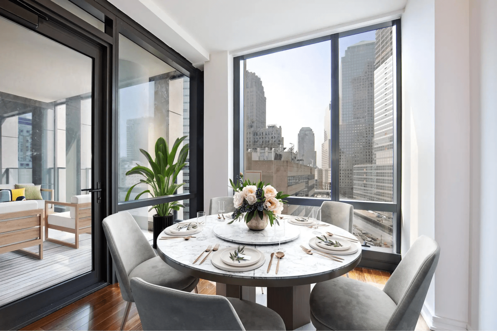 A dining room table with chairs and plates on it