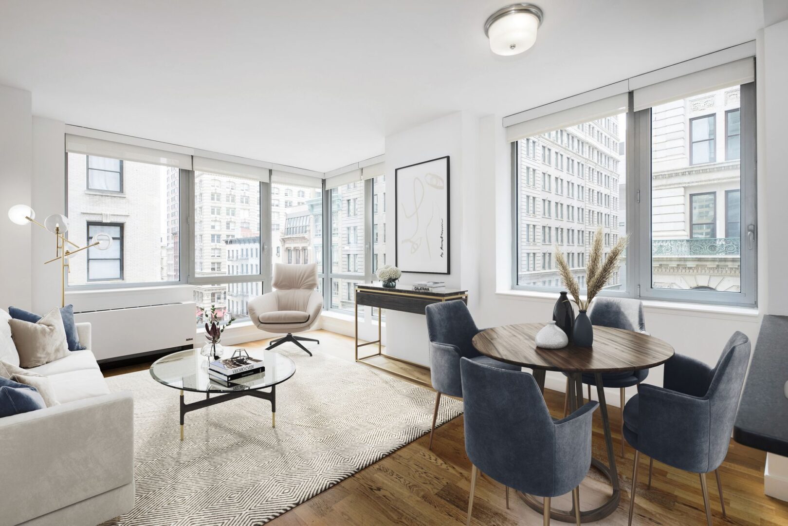 A living room with a table and chairs in it